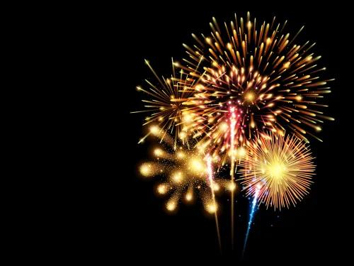 A collection of colorful fireworks exploding against a black background
